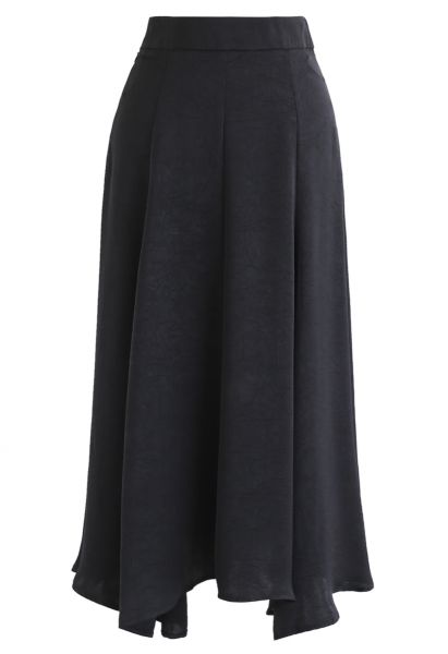 Falda midi asimétrica de textura sedosa en negro