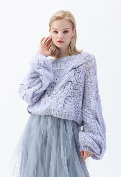 Jersey de mangas de hojaldre tejido a mano en azul