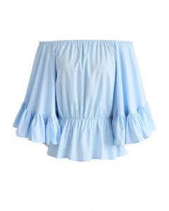 Top sin hombros con volantes en azul