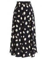 Falda midi bicolor con estampado de lunares irregulares en negro
